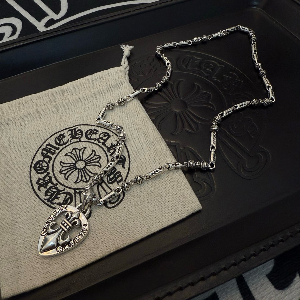 Silver-tone heart locket necklaces with chain loops on pouch and black box