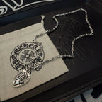 Silver-tone heart locket necklaces with chain loops on pouch and black box