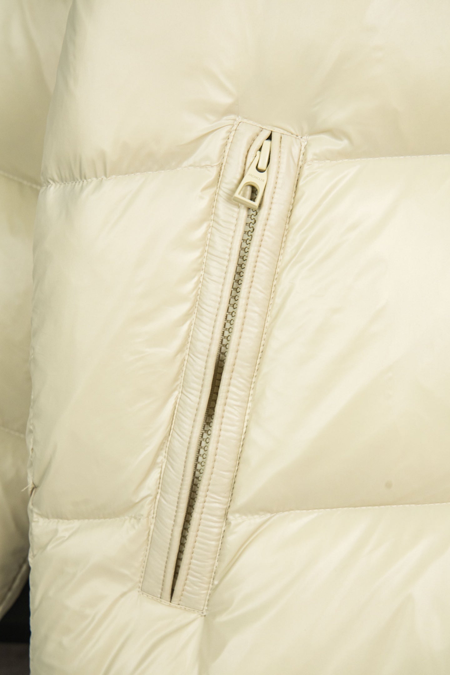Cream puffer jacket with center front zipper and stitched trim
