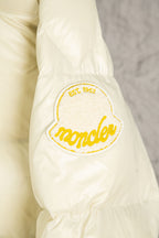 Cream Moncler sleeve with embroidered crest patch and yellow outline