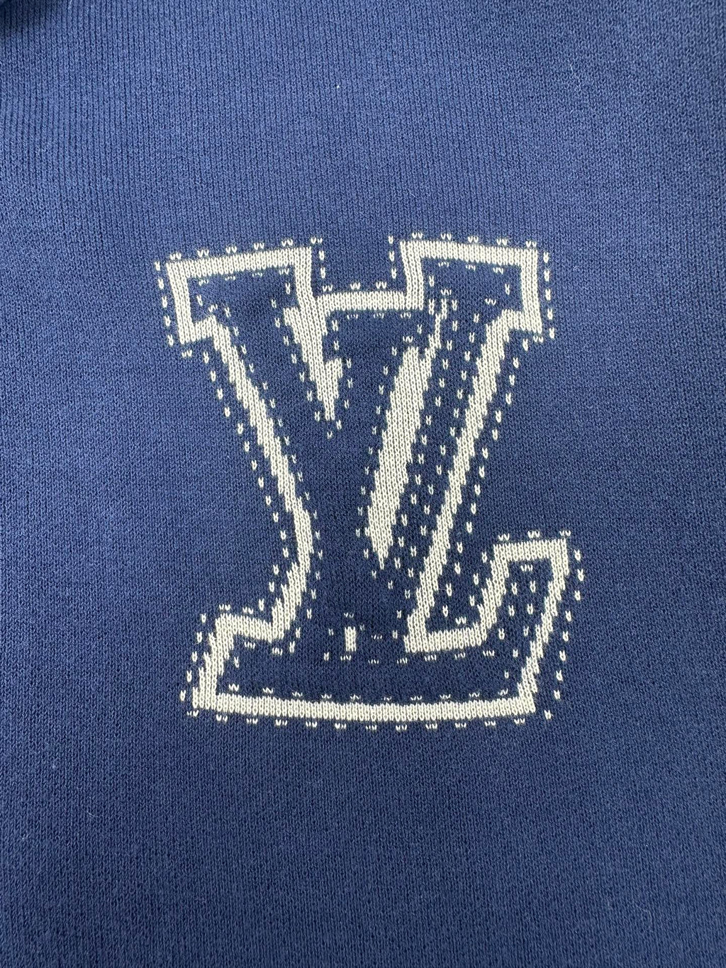 Louis Vuitton blue knit hoodie with large LV logo applique