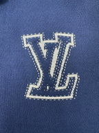 Louis Vuitton blue knit hoodie with large LV logo applique