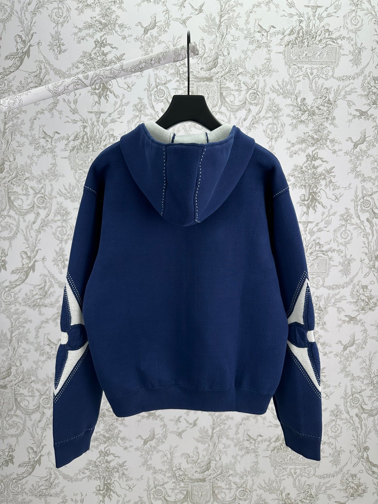 Louis Vuitton blue zip-up hoodie back view with hood and sleeve logo patches