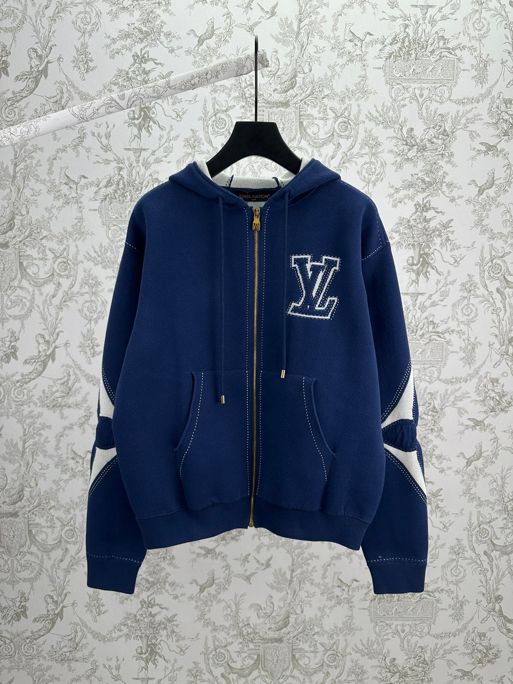 Louis Vuitton blue zip-up hoodie with LV logo, hood and front zip pockets