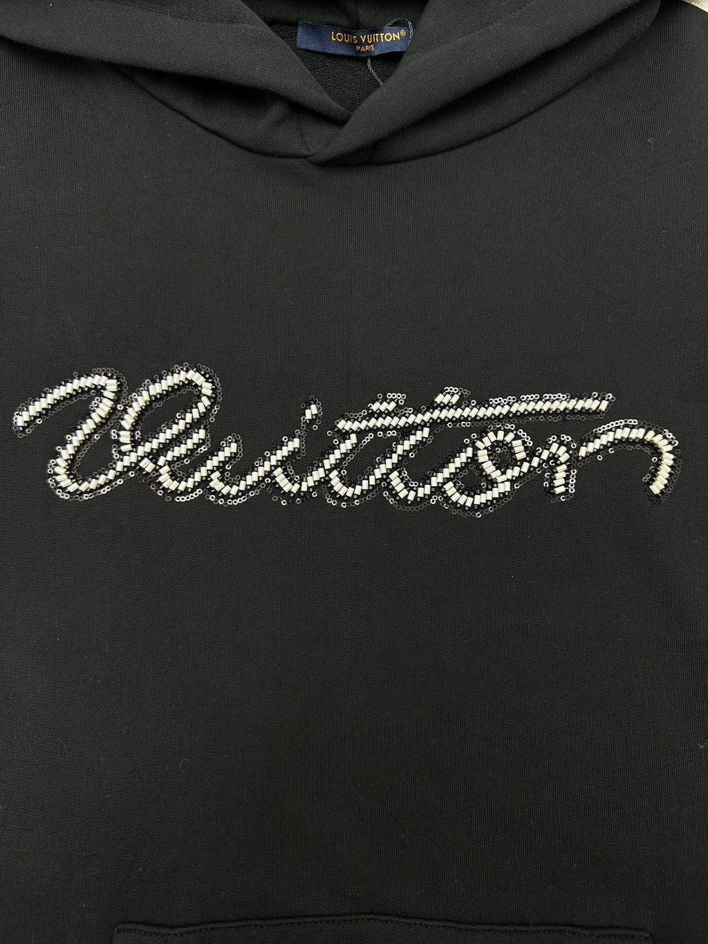 Louis Vuitton black hoodie with rhinestone-style script logo across chest