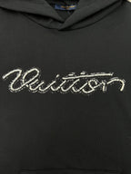 Louis Vuitton black hoodie with rhinestone-style script logo across chest