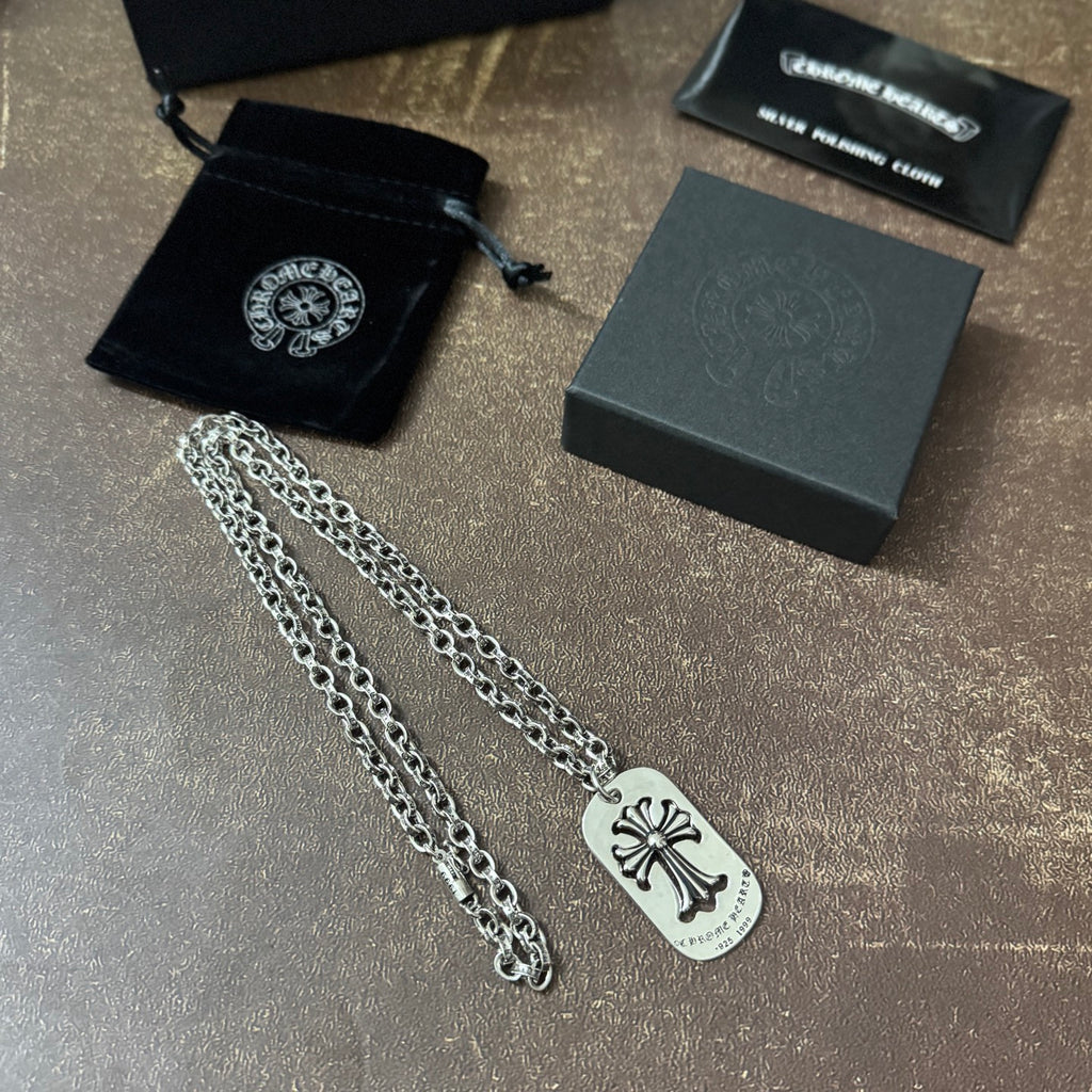 Chrome accessories necklace pair with silver chains and fleur-de-lis dog-tag pendants