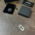 Chrome accessories necklace pair with silver chains and fleur-de-lis dog-tag pendants