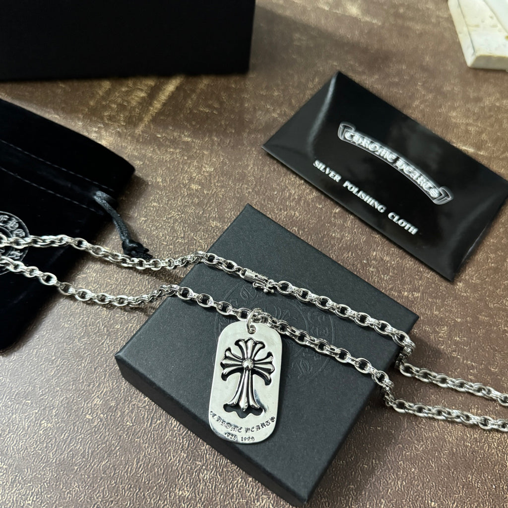 Chrome accessories necklace with silver fleur-de-lis dog-tag pendant on a chain