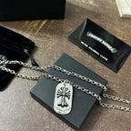 Chrome accessories necklace with silver fleur-de-lis dog-tag pendant on a chain