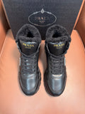 Prada lace-up winter boots with dark faux-fur lining and metal logo patch