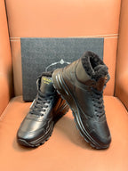 Prada lace-up boots with dark leather and faux-fur collar, front angle