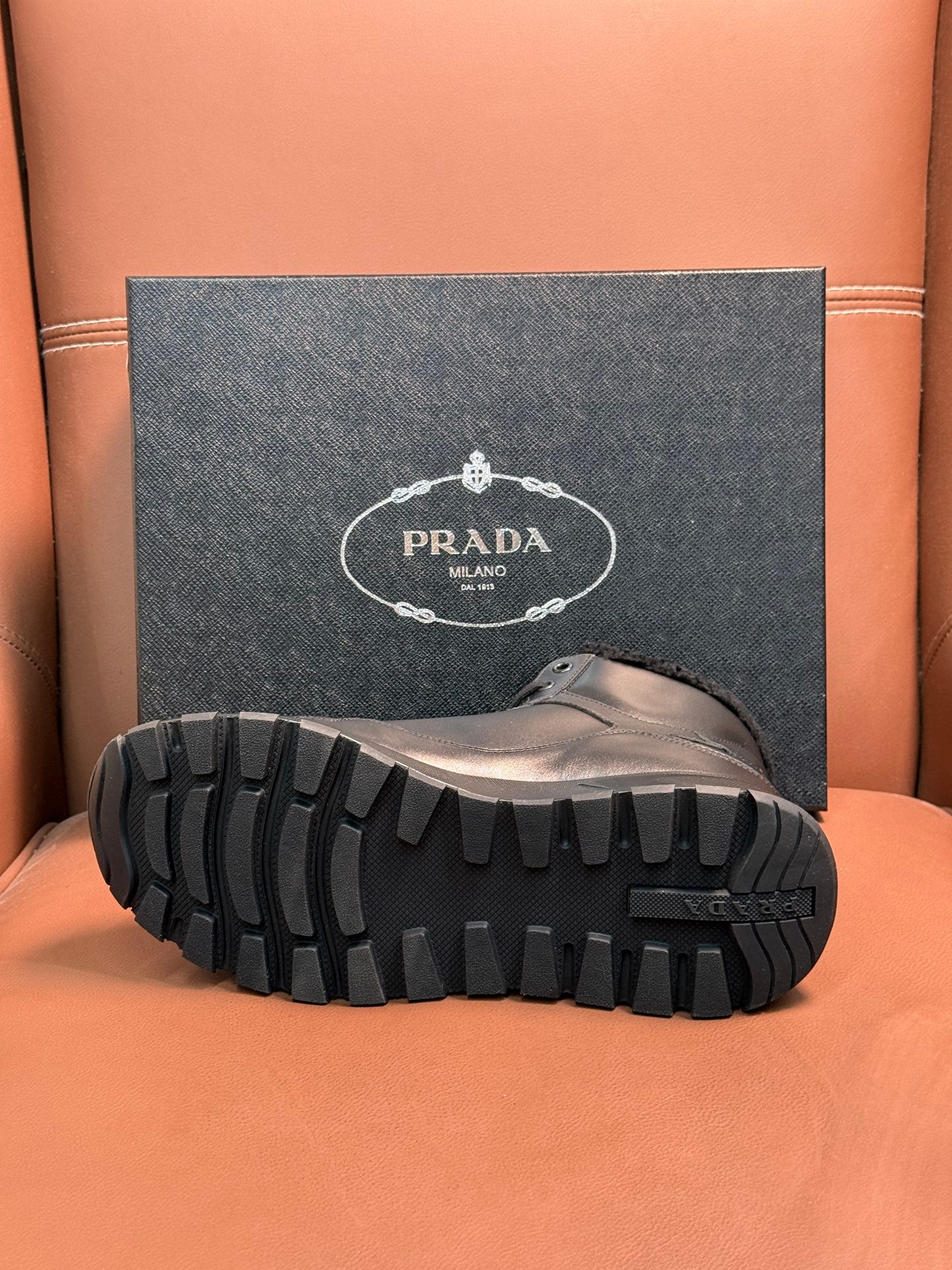 Prada boot outsole with thick lug tread and textured rubber pattern