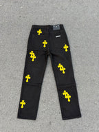 Chrome pants in dark fabric with yellow cross prints and front fly button closure