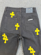 Chrome pants back view in gray with yellow cross prints and two rear pockets