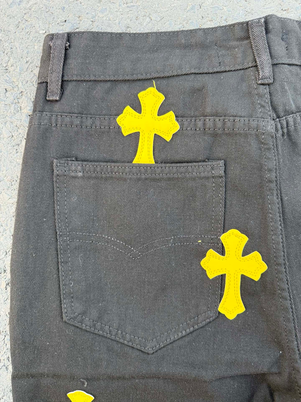 Chrome pants back pocket in gray with yellow cross graphics