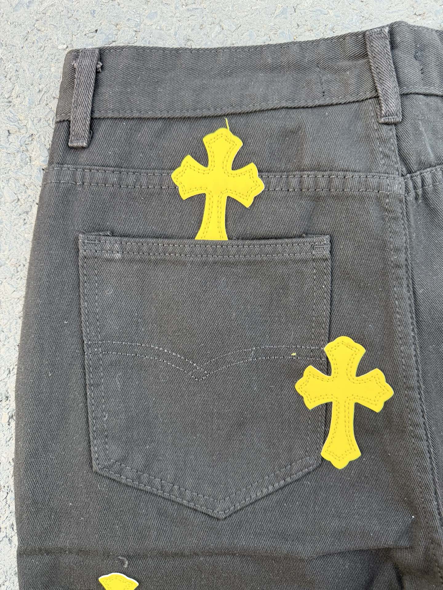 Chrome pants back pocket in gray with yellow cross graphics