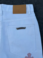 Light blue pants with logo patch on back pocket and red cross detail on side