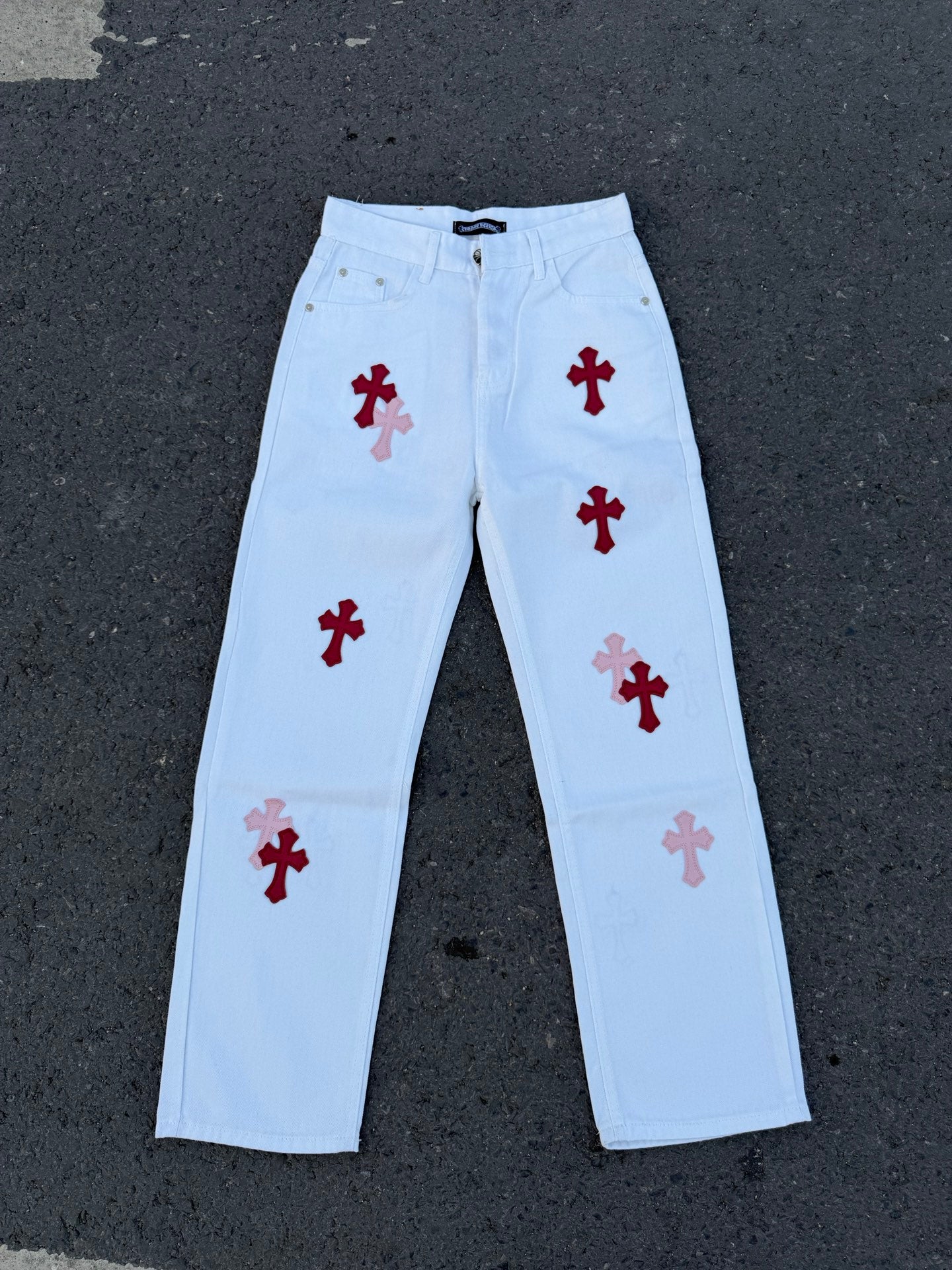 Light blue pants with red cross and darker red cross prints on front legs