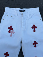 Light blue pants with red cross prints, waistband and front pockets visible