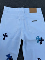 Light blue pants with navy cross print, front pocket and waist details