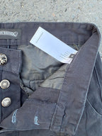 Dark gray pants showing button closure, interior tag, and side seam pocket