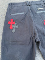 Dark gray pants back view with red cross patch and horizontal back pocket strap