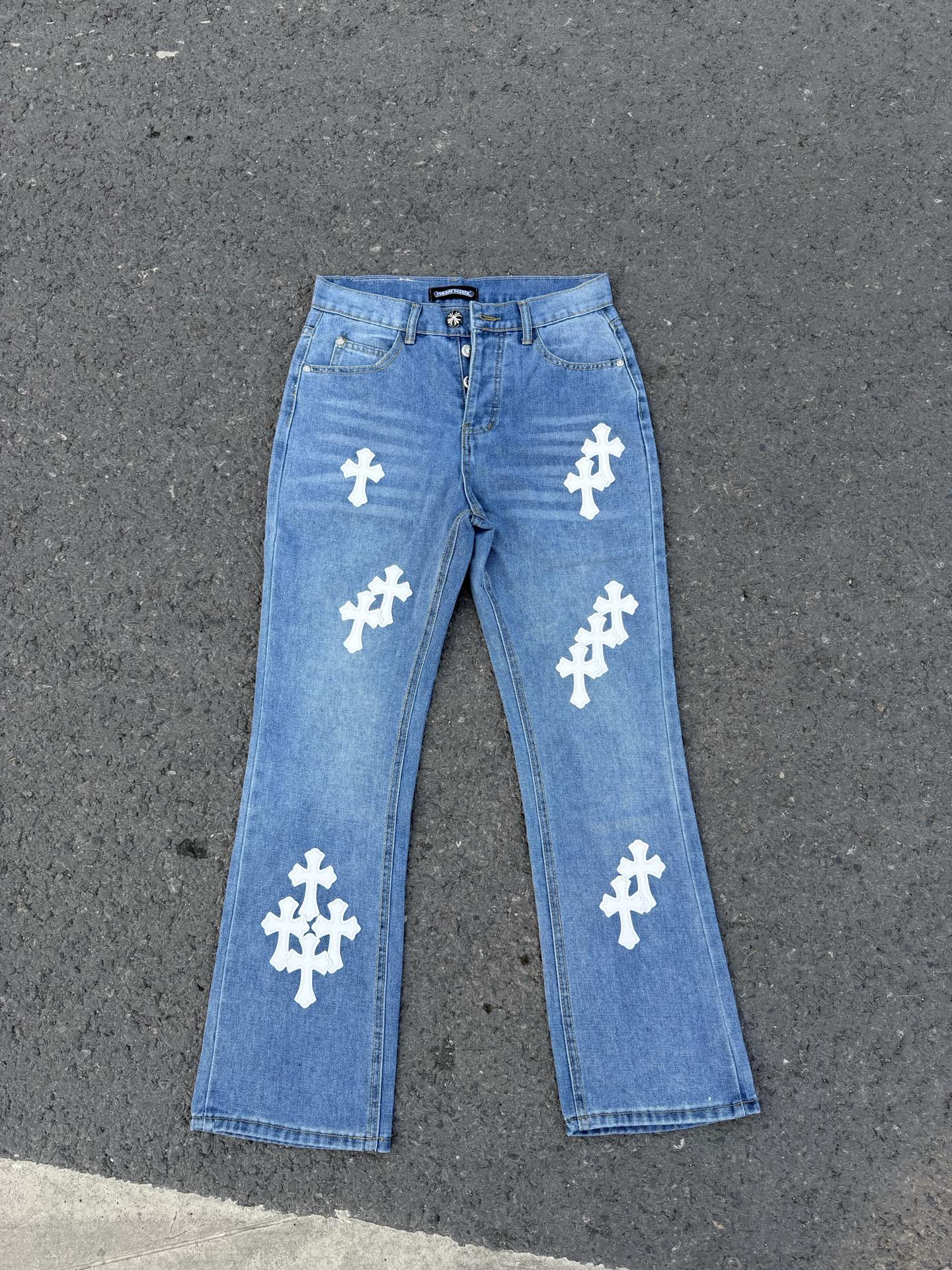 Light blue denim jeans with white cross patches, straight leg.