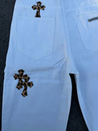 Light blue pants back view with two rear pockets and dark cross patches