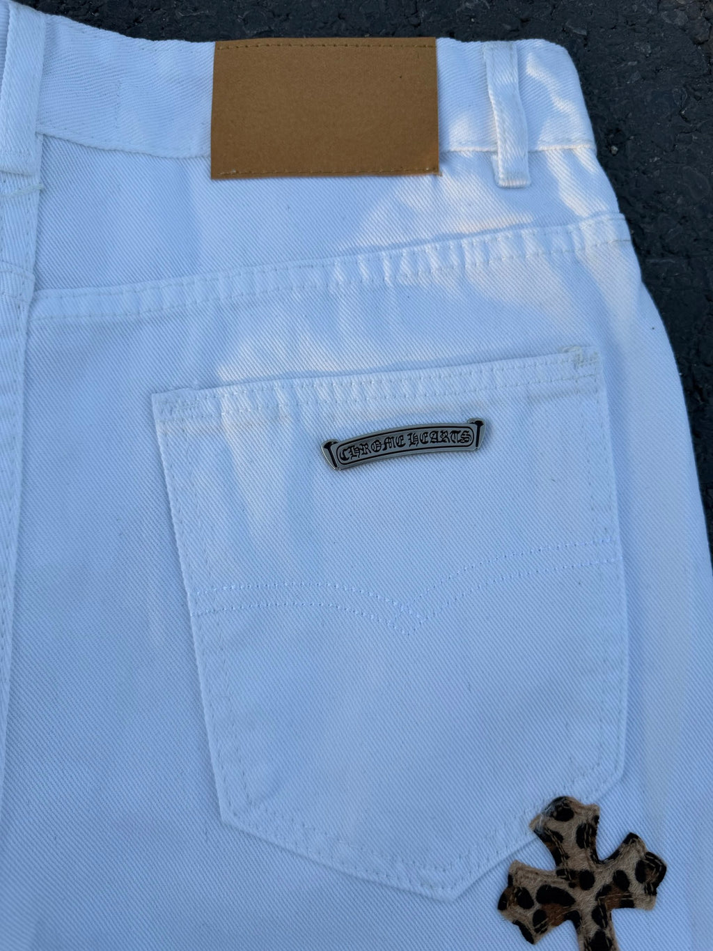Light blue pants back detail with rectangular logo patch and rear coin pocket