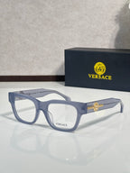 Versace eyeglasses with light blue-gray frame and gold Medusa emblem on the temple, clear lenses