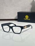 Versace eyeglasses with dark navy frame and gold Medusa emblem on the temple, clear lenses