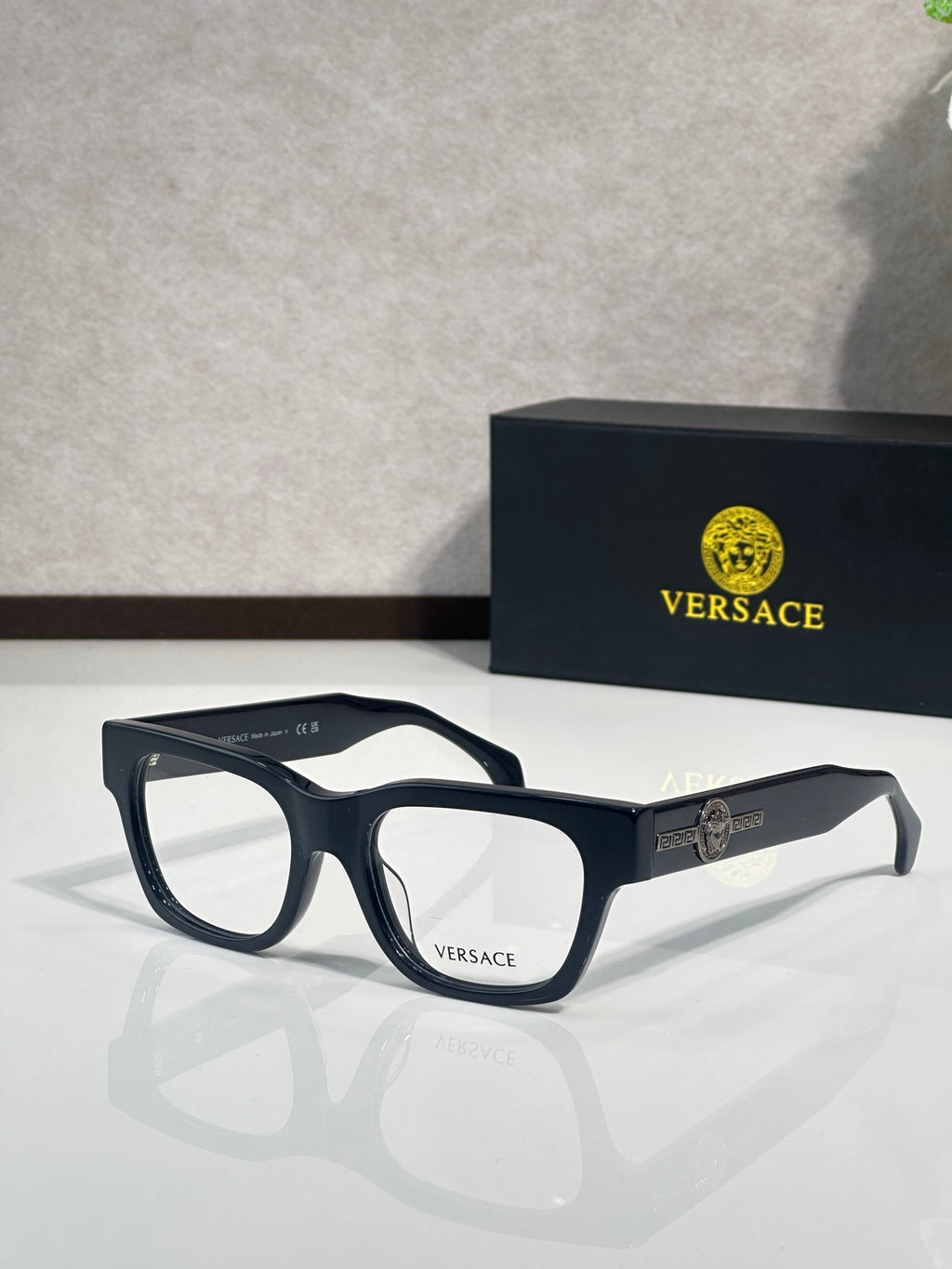 Versace eyeglasses with dark navy frame, clear lenses, and gold Medusa emblem detail on temple