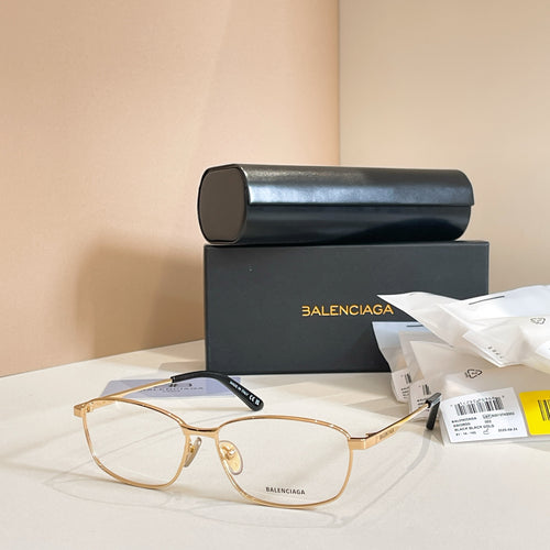 Balenciaga glasses with gold metal full-rim frames and clear lenses