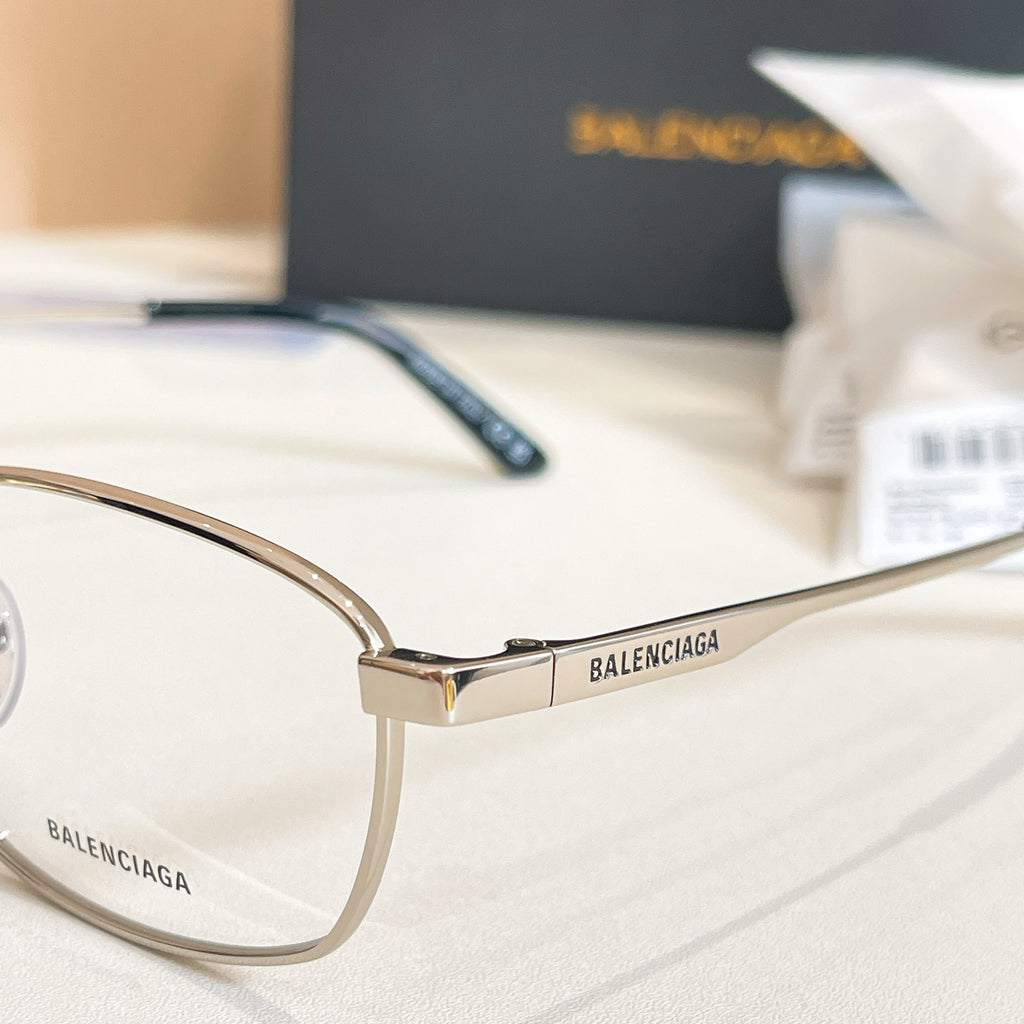 Balenciaga glasses side view with gold frame and dark blue temple with BALENCIAGA