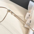 Balenciaga glasses close-up: clear lenses and metal temple engraved BALENCIAGA