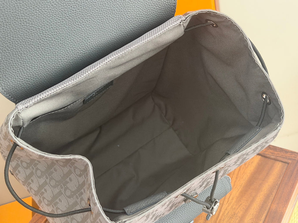 Dior men’s backpack open interior with gray lining and drawstring closure