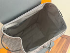 Dior men’s backpack open interior with gray lining and drawstring closure