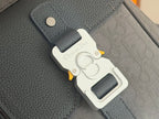 Dior gray leather strap attachment with white tag and metal clip