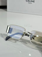 Silver rectangular sunglasses with light blue-tinted lenses