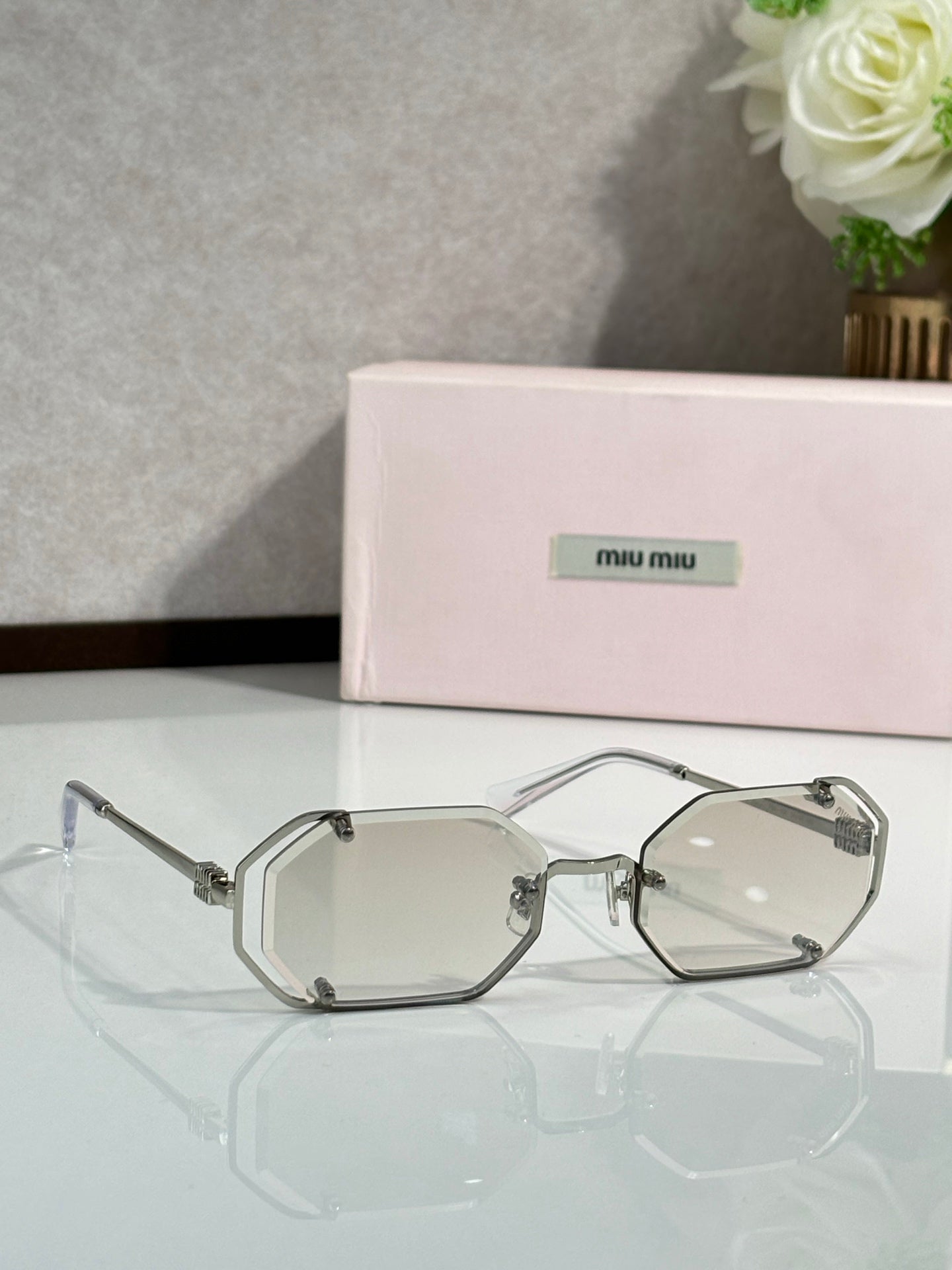 Miu Miu octagonal eyeglasses, silver frame with clear lenses