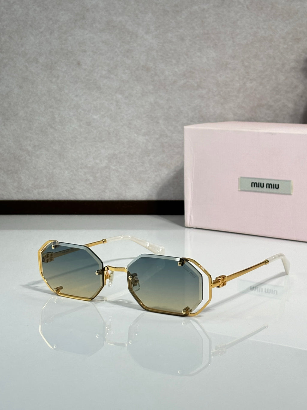 Miu Miu octagonal sunglasses, gold frame with dark lenses