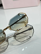 Miu Miu octagonal sunglasses close-up, gold hinge with tinted lens