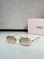 Miu Miu octagonal sunglasses, gold frame with clear-tinted lenses