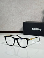 Black full-rim eyeglasses with clear lenses and gold detail temples