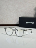 Silver full-rim eyeglasses with clear lenses and decorative hinge detail