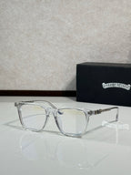 Silver full-rim eyeglasses with clear lenses and decorative temple details
