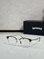 Eyeglasses with olive-green metal frame and clear lenses, blue temple tips