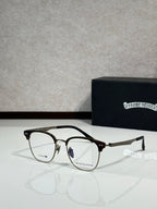 Eyeglasses with dark metal frame and clear lenses, curved temple arms