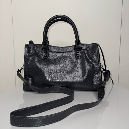 Balenciaga leather handbag with shoulder strap, front zip pocket, dark finish